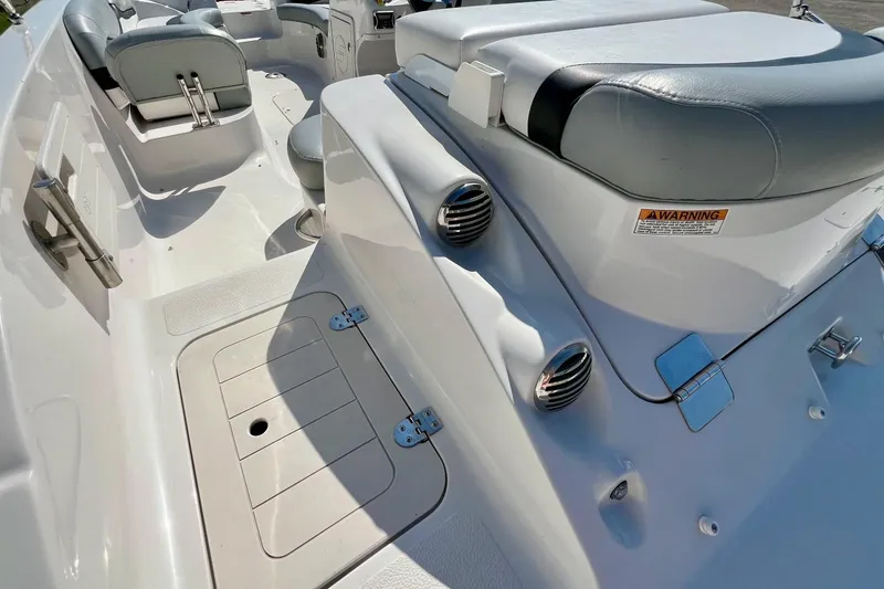 Slide: The Image of 2014 Starcraft 2000 OB Limited boat interior with seating and storage compartments. - 5