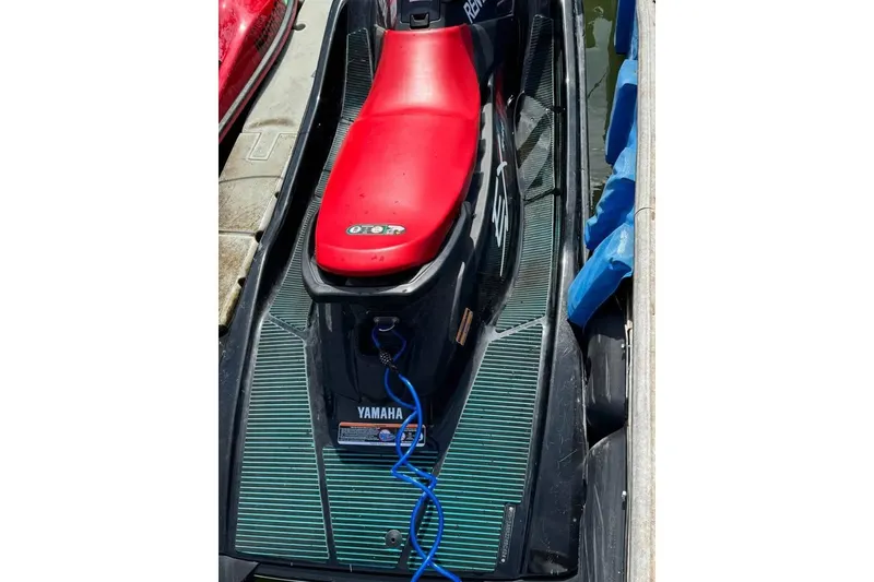 Slide: The Image of 2024 Yamaha WaveRunner EX Sport with red seat, docked and ready for adventure. - 1