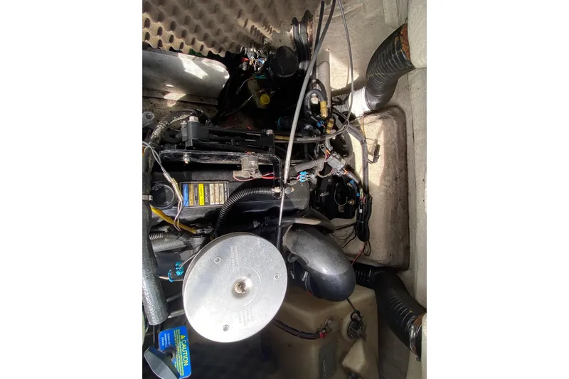 Slide: The Image of Engine compartment of a 2008 Sea Ray 175 Sport boat, showing mechanical components. - 13