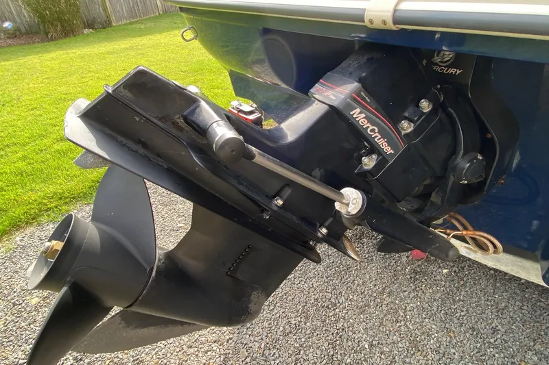 Slide: The Image of 2008 Sea Ray 175 Sport boat with MerCruiser engine, parked on gravel. - 5