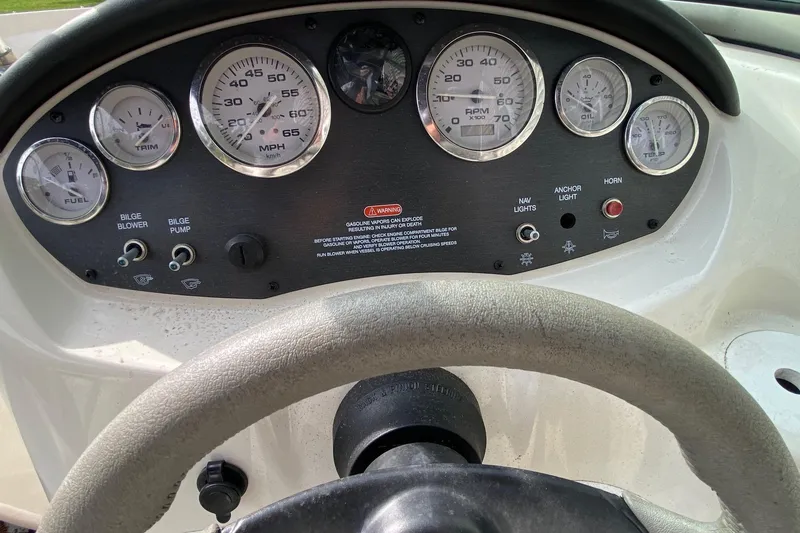 Slide: The Image of Dashboard of a 2008 Sea Ray 175 Sport boat with gauges and controls. - 9