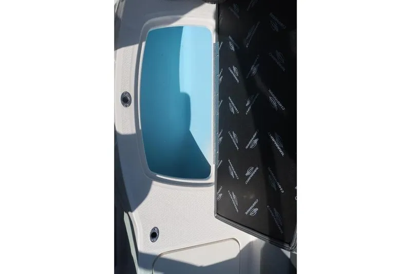 Slide: The Image of 2026 Chaparral 21 SSi boat rear view with seating and swim platform. - 10