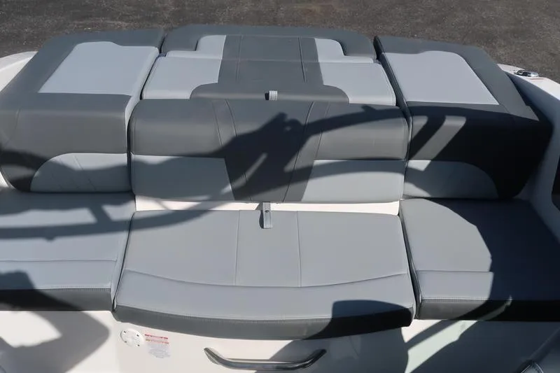Slide: The Image of 2026 Chaparral 21 SSi boat seating, featuring sleek gray upholstery design. - 12