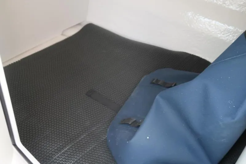 Slide: The Image of 2026 Chaparral 21 SSi boat interior with gray seating and speakers. - 23