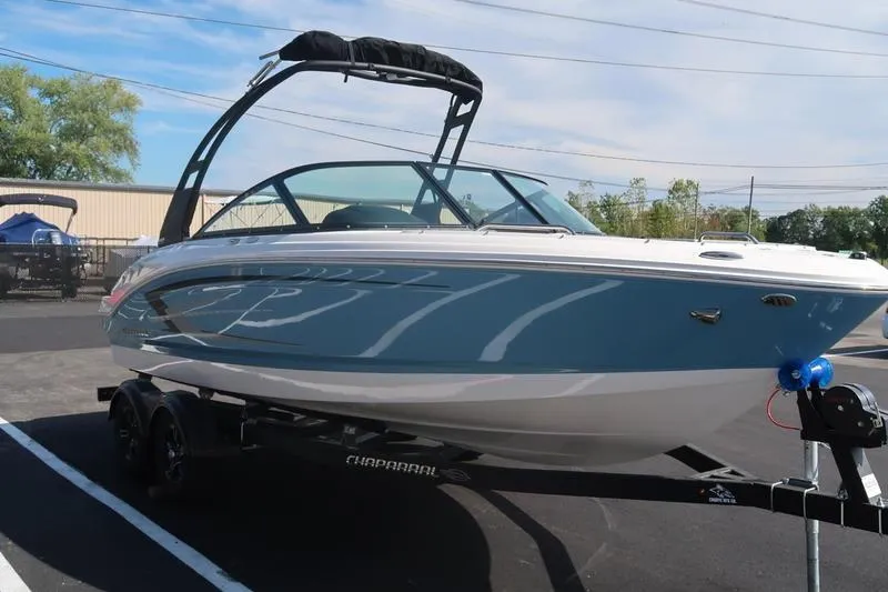 Slide: The Image of 2026 Chaparral 21 SSi boat on trailer, parked outdoors, rear view. - 4