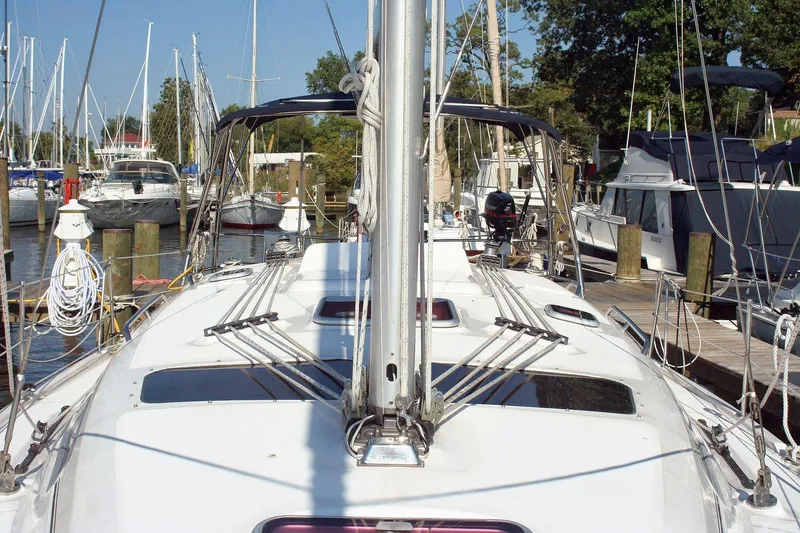 Slide: The Image of Sailboat docked at marina, Hunter 38 model, 2006, surrounded by other boats. - 10