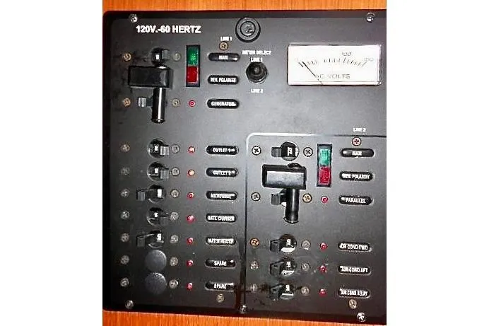 Slide: The Image of Interior of 2006 Hunter 38 sailboat with wood finish and seating area. - 19