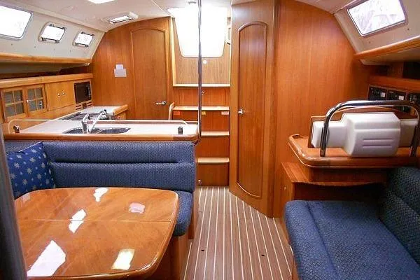 Slide: The Image of Interior of 2006 Hunter 38 sailboat with wood finish and cozy seating area. - 25