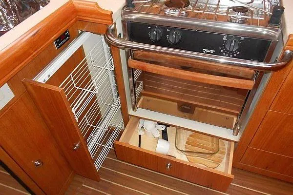 Slide: The Image of Interior of a 2006 Hunter 38 sailboat with wood finish and seating area. - 29
