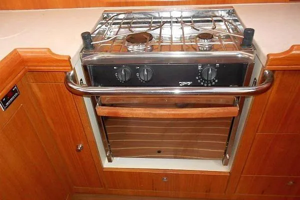 Slide: The Image of Interior of 2006 Hunter 38 sailboat with wood finish and cozy seating area. - 30