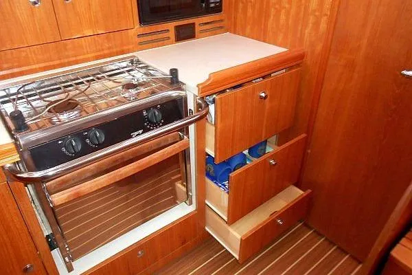 Slide: The Image of Luxurious interior of 2006 Hunter 38 yacht with elegant wood and plush seating. - 33
