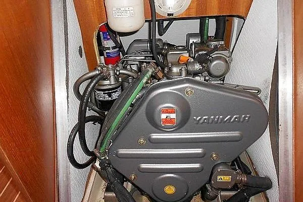 Slide: The Image of Yanmar engine in a 2006 Hunter 38 sailboat, showcasing detailed components and layout. - 52