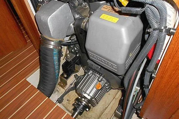 Slide: The Image of Engine compartment of a 2006 Hunter 38 sailboat, showing mechanical components and wiring. - 53