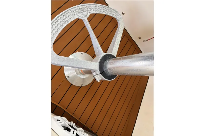 Slide: The Image of Close-up of a metal steering wheel on a 2006 Parker 2520 XL Sport Cabin boat. - 17