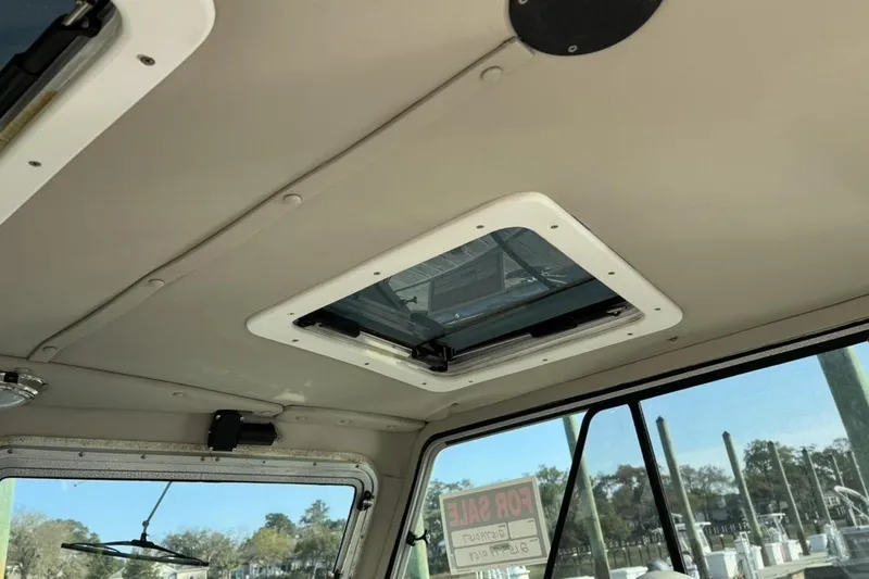 Slide: The Image of Interior view of 2006 Parker 2520 XL Sport Cabin with sunroof and windows. - 9
