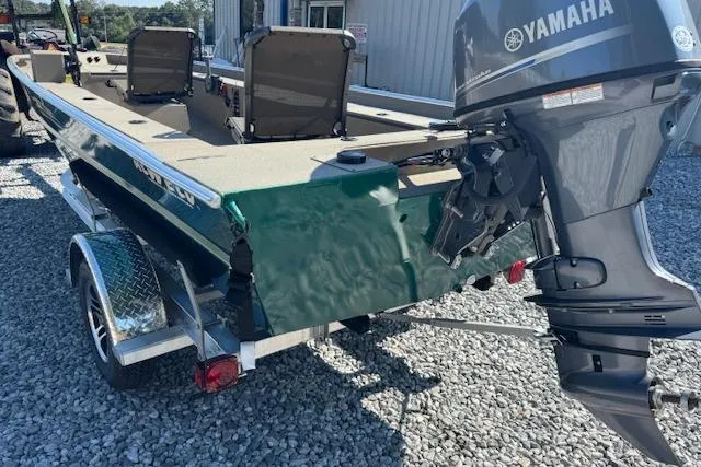 Slide: The Image of 2025 Alweld 1856 PF boat with Yamaha outboard motor on gravel surface. - 12