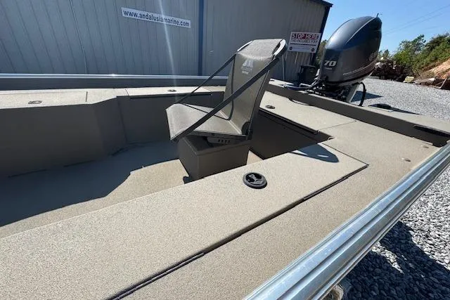 Slide: The Image of 2025 Alweld 1856 PF boat with seating and outboard motor, displayed outdoors. - 6