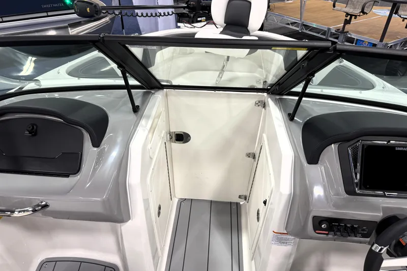Slide: The Image of 2026 Chaparral 21 SSi Ski & Fish boat interior with windshield and control panel. - 27