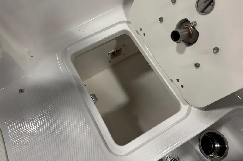 Slide: The Image of 2026 Chaparral 21 SSi Ski & Fish boat storage compartment, open and empty. - 30