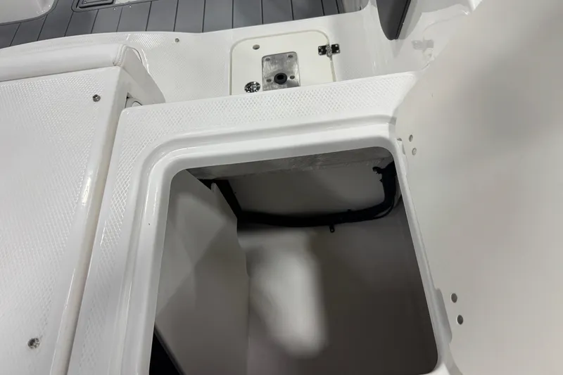 Slide: The Image of Open storage compartment on 2026 Chaparral 21 SSi Ski & Fish boat. - 31