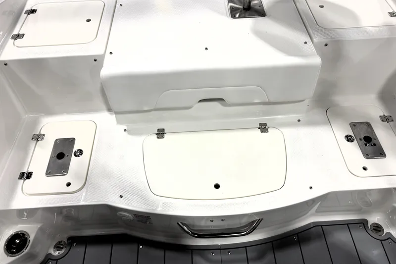 Slide: The Image of 2026 Chaparral 21 SSi Ski & Fish boat interior with storage compartments and seating. - 35