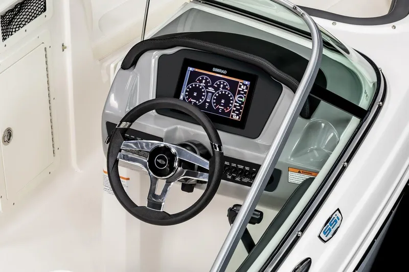 Slide: The Image of 2026 Chaparral 21 SSi Ski & Fish boat displayed at an indoor exhibition. - 5