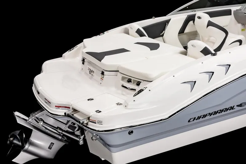 Slide: The Image of 2026 Chaparral 21 SSi Ski & Fish boat interior with cushioned seating and speaker. - 9