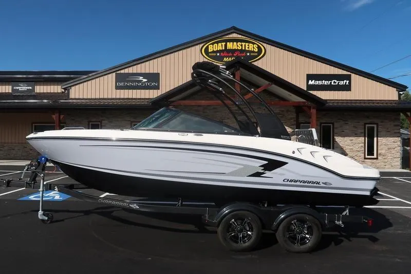The Image of 2026 Chaparral 21 SSi boat on trailer in elegant indoor setting. - 0