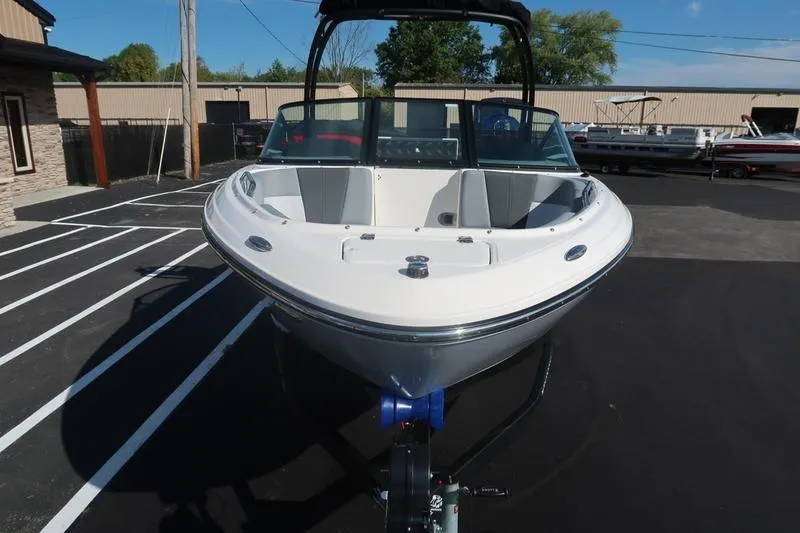 Slide: The Image of 2026 Chaparral 21 SSi boat interior with gray and white cushioned seating. - 10