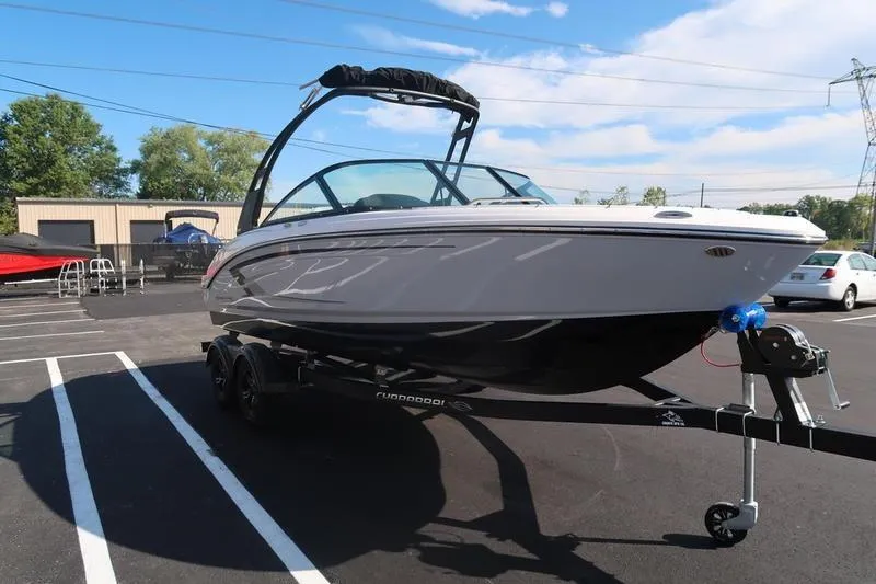 Slide: The Image of 2026 Chaparral 21 SSi boat interior with storage compartment and branded upholstery. - 12