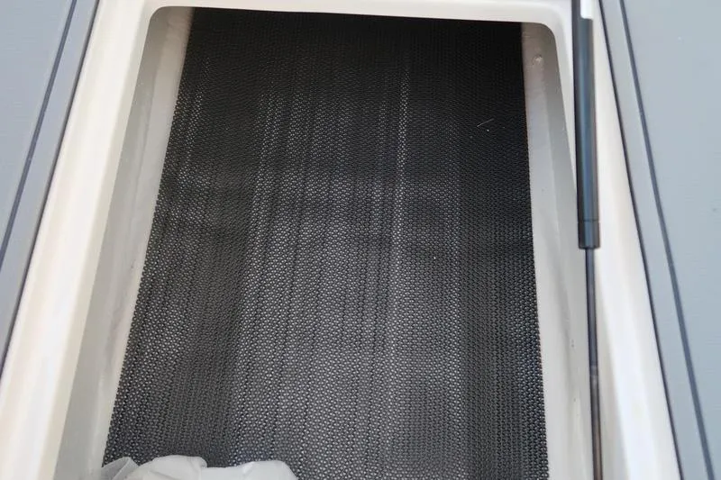 Slide: The Image of USB charging port on 2026 Chaparral 21 SSi boat dashboard. - 14