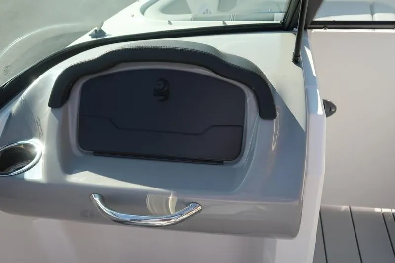 Slide: The Image of 2026 Chaparral 21 SSi boat dashboard with Simrad display and steering wheel. - 16