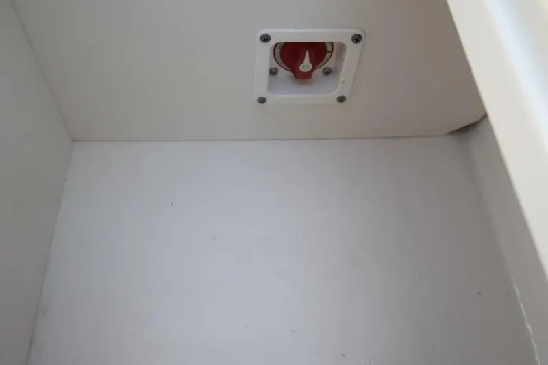 Slide: The Image of 2026 Chaparral 21 SSi boat interior with gray flooring and white seats. - 18