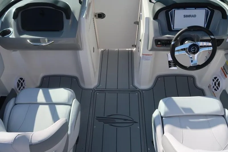 Slide: The Image of 2026 Chaparral 21 SSi capacity label: 12 persons or 1692 lbs maximum. - 20