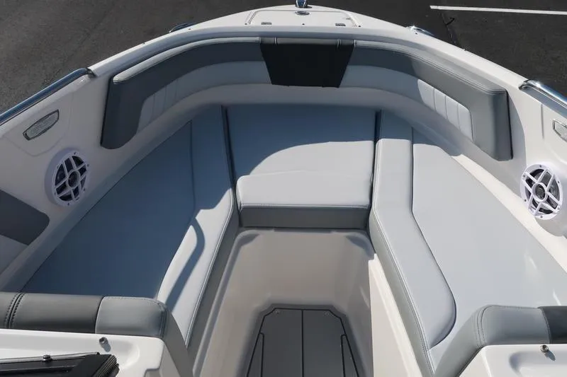 Slide: The Image of 2026 Chaparral 21 SSi boat interior with gray seating and built-in speakers. - 26
