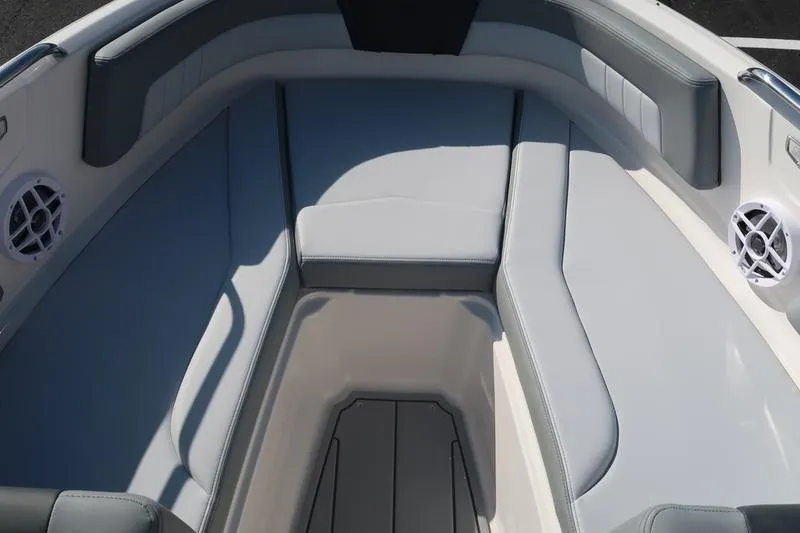 Slide: The Image of 2026 Chaparral 21 SSi boat interior with gray seating and speakers. - 27