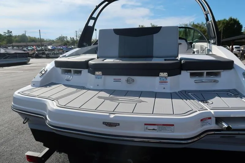 Slide: The Image of 2026 Chaparral 21 SSi boat on trailer in parking lot, rear view. - 6