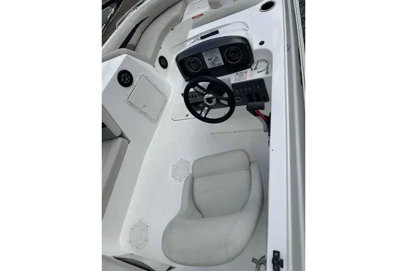 Slide: The Image of 2023 Hurricane SunDeck Sport 188 IO boat interior with steering wheel and seating. - 3