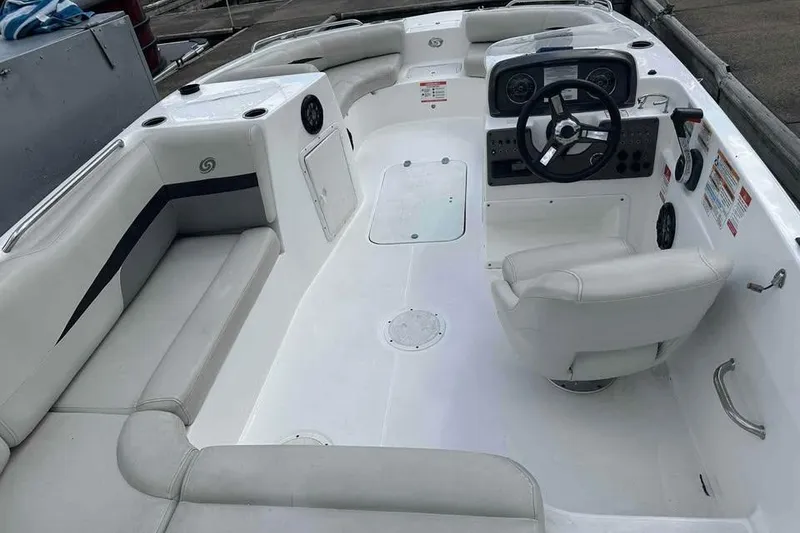 Slide: The Image of 2023 Hurricane SunDeck Sport 188 IO boat interior with seating and steering console. - 5