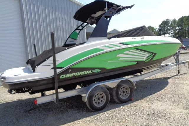 The Image of 2018 Chaparral Vortex 243 VRX boat with green and white design on a trailer. - 1