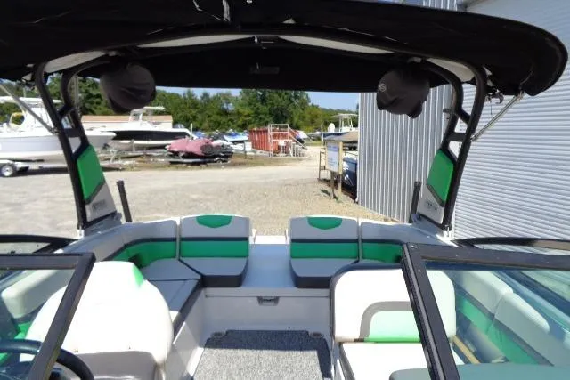 Slide: The Image of 2018 Chaparral Vortex 243 VRX boat interior with green and white seating. - 7