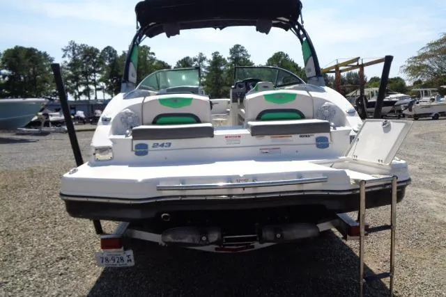 Slide: The Image of 2018 Chaparral Vortex 243 VRX boat, rear view, parked on gravel lot. - 9
