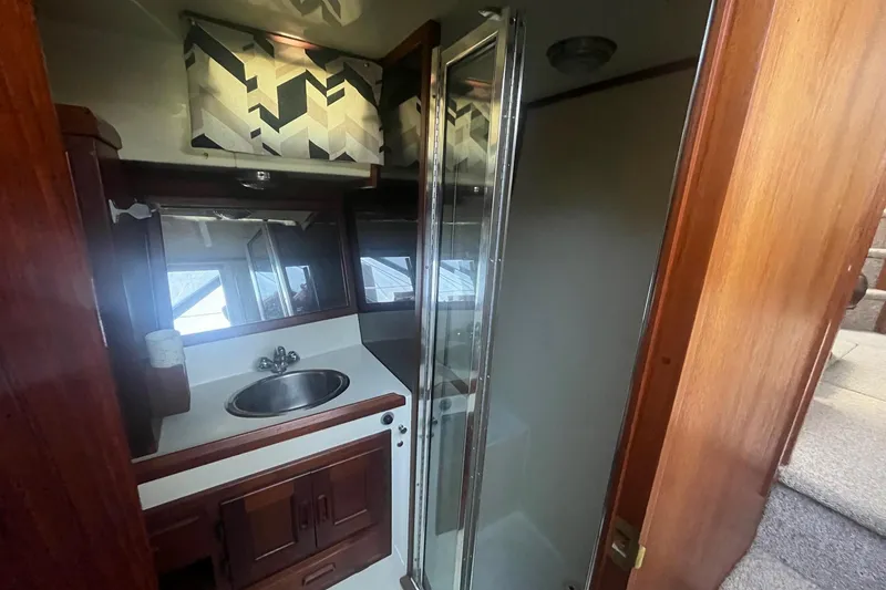 Slide: The Image of Bathroom interior of 1990 Cooper Prowler 35 yacht with sink and shower. - 15
