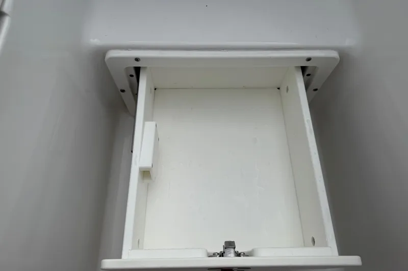 Slide: The Image of Empty storage compartment on 2021 Sea Hunt Gamefish 27 Forward Seating boat. - 11