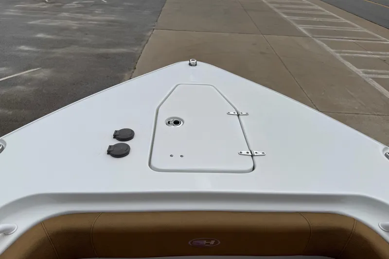 Slide: The Image of 2021 Sea Hunt Gamefish 27 Forward Seating boat deck, featuring storage hatch and fittings. - 12