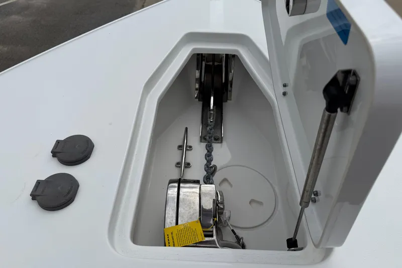 Slide: The Image of Anchor compartment of 2021 Sea Hunt Gamefish 27 Forward Seating boat. - 17