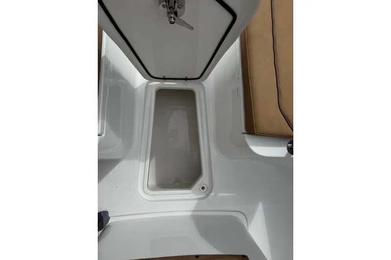 Slide: The Image of 2021 Sea Hunt Gamefish 27 Forward Seating storage compartment with open hatch. - 20