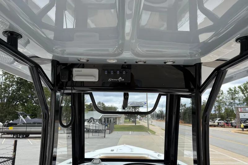 Slide: The Image of 2021 Sea Hunt Gamefish 27 boat console with Garmin electronics and forward seating. - 25