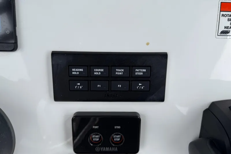 Slide: The Image of Control panel of 2021 Sea Hunt Gamefish 27 boat with Yamaha buttons. - 28