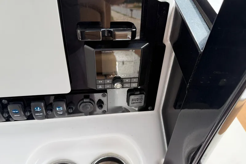 Slide: The Image of Control panel of 2021 Sea Hunt Gamefish 27 with JL Audio system. - 29